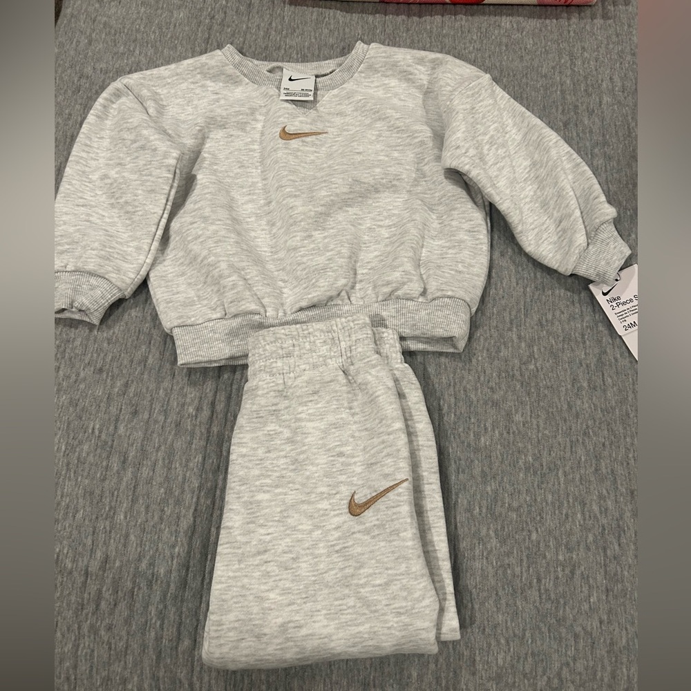 NWT! Nike Light Gray 2 piece set. Joggers and crew neck sweatshirt. 24 months.